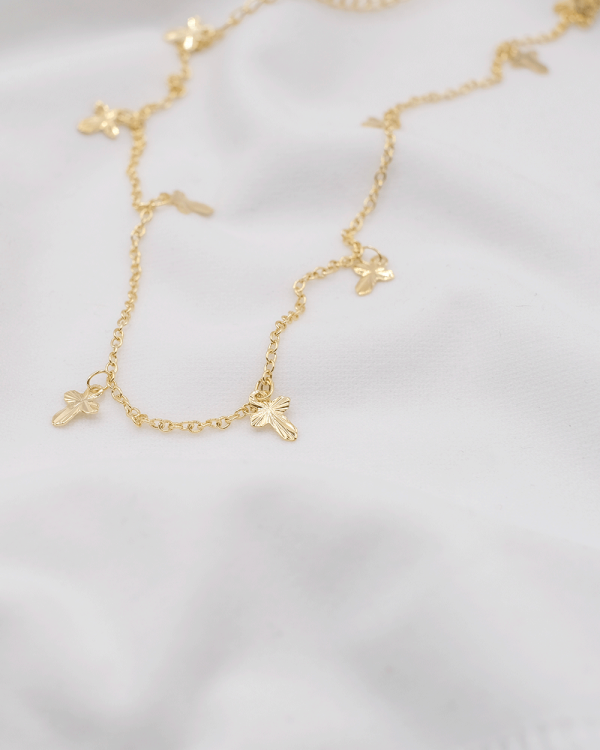 CADENA CON NUEVE CRUCES COLGANTES ORO LAMINADO 18KT